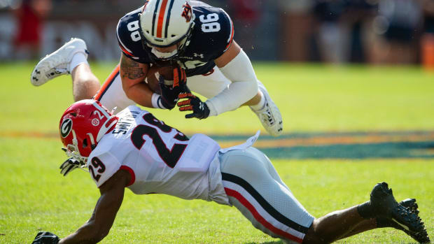 Auburn Tigers tight end Luke Deal (86) fights for yards against Georgia Bulldogs defensive back Christopher Smith (29) at Jordan-Hare Stadium in Auburn, Ala., on Saturday, Oct. 9, 2021. Auga01